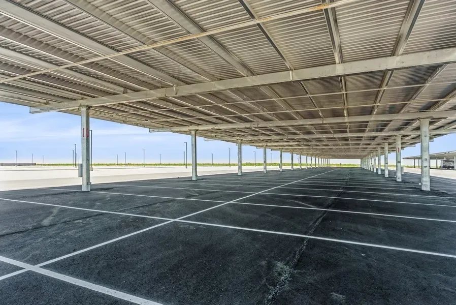A close up shot of empty covered parking spaces.